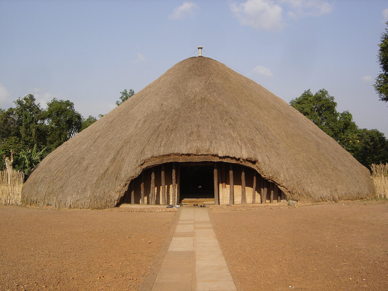 Monumental traditional thatched architecture at the Kasubi Tombs in Kampala